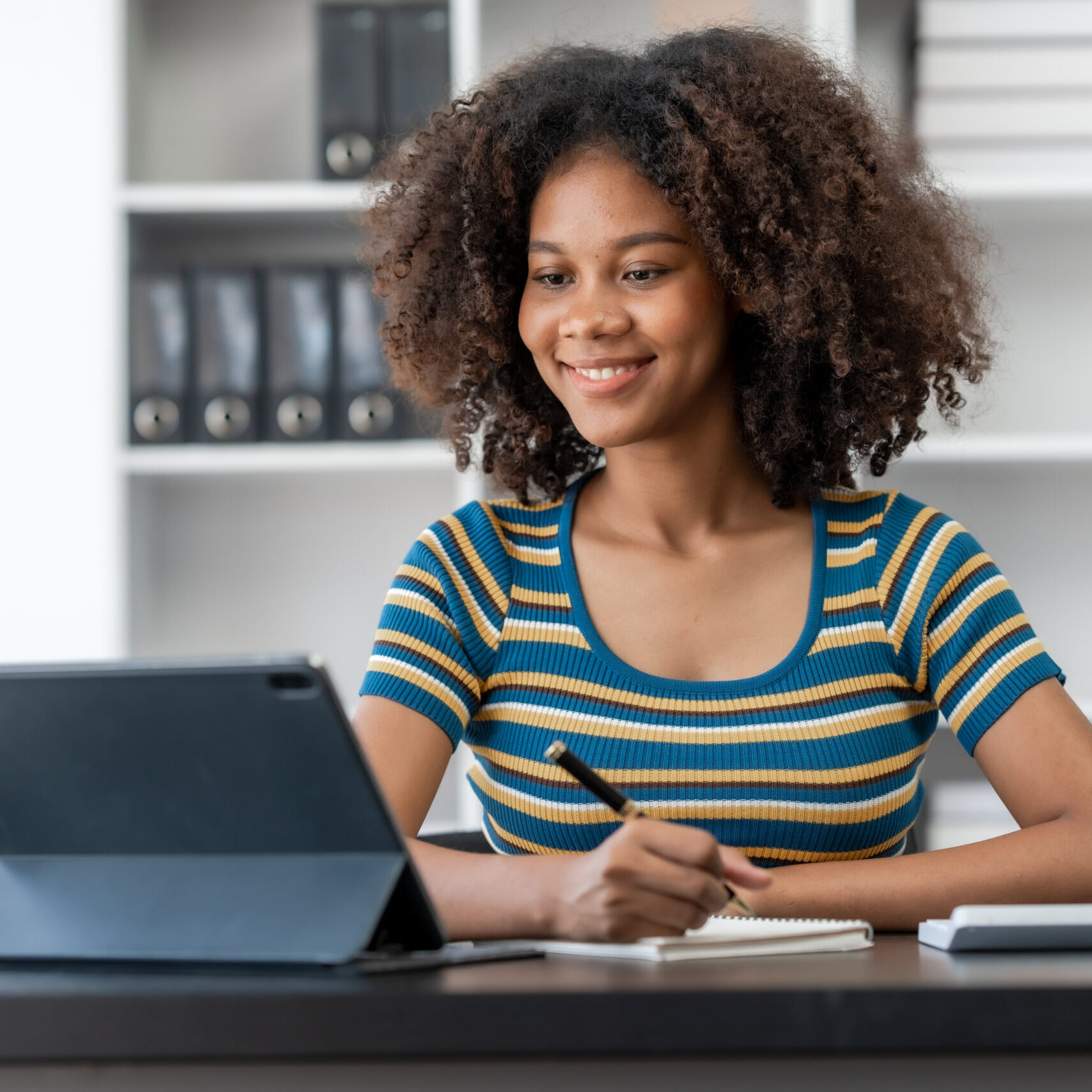 Young female african american student learning chinese language class online lecture via video conference, distance education Young female african american student learning chinese language class online lecture via video conference, distance education